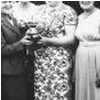 Bessie Dobson presents rose-bowl trophy to Mary Eddy of the Bowls Club