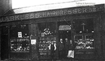 John Arkless is pictured outside his hairdresser's shop in the old Town Hall.