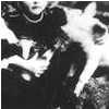 Lily Atchison with a piglet c.1910